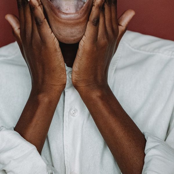 Smiling person feeling energetic and positive after a gentle workout session.